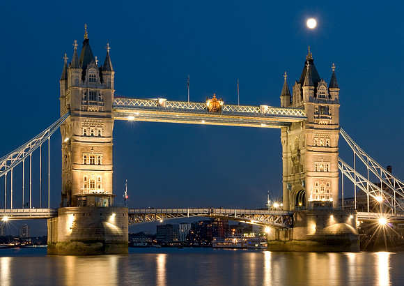 Tower Bridge at Dusk with moon and reflections.