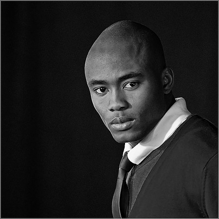 Red Tie. Portrait of a fashionable young black man.